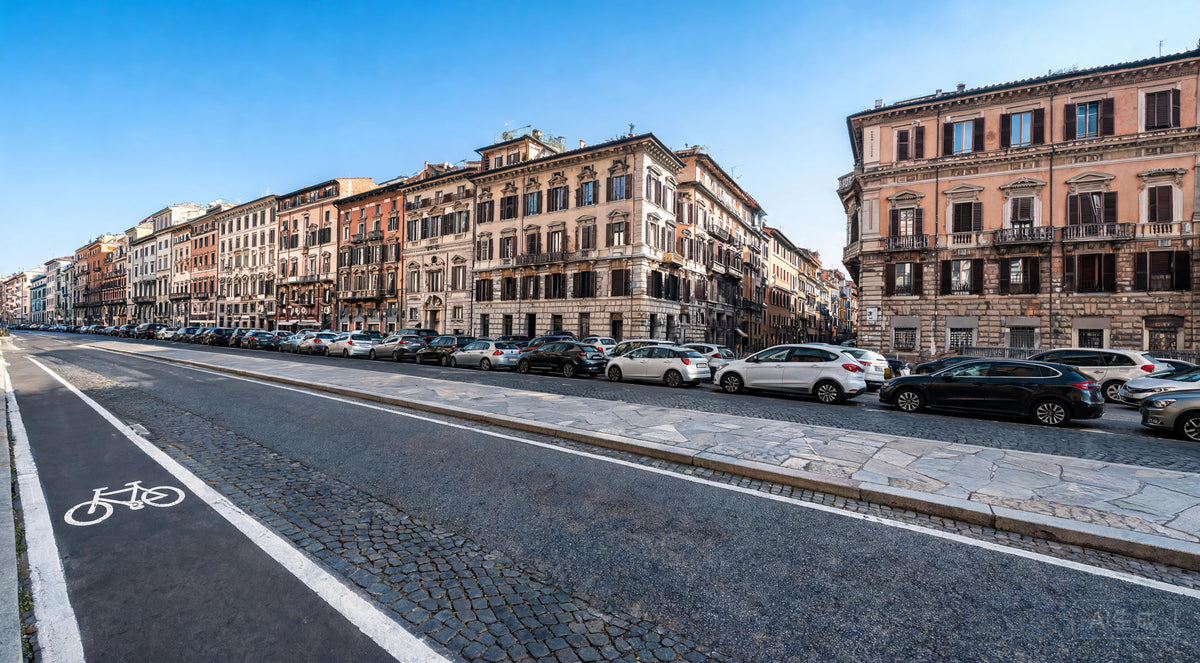 Empty bike lane on Italian city street with parked cars and European buildings