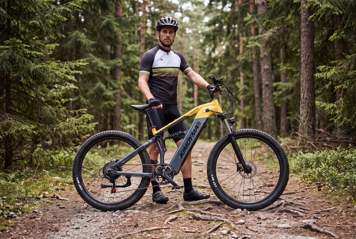 Mountain bike elettrica su un sentiero forestale che mostra i dettagli della ruota e del cerchio per il confronto tra carbonio e alluminio