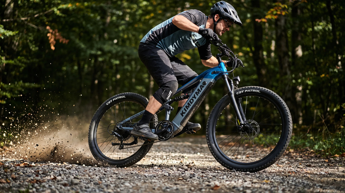 A cyclist riding a Kimdyma all-terrain electric mountain bike at high speed on a forest gravel trail, with motion blur a